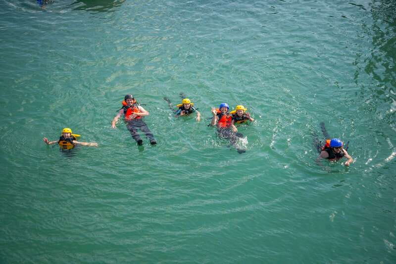 Banff: Kananaskis River Whitewater Rafting Tour - Getting suited up for cold Canadian water