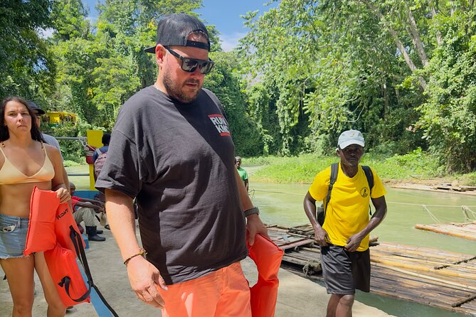 Experience Day Rafting on the Martha Brae River - Life vests, a complimentary drink, and the river launch