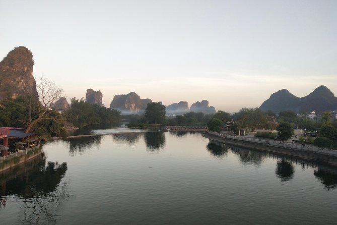 Full-day Tour: Cycling, Rafting & SanjieLiu Outdoor Water Theatre - The Yulong River from a bamboo raft