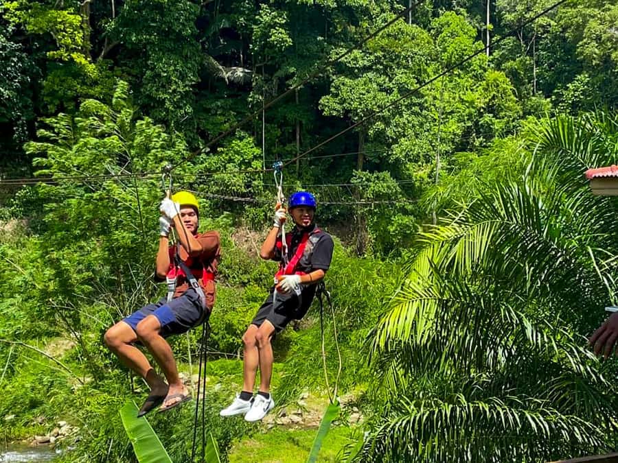 KhaoLak:ATV, ZipLine, & Rafting Adventure Monkey Cave Temple - ATV riding through green countryside