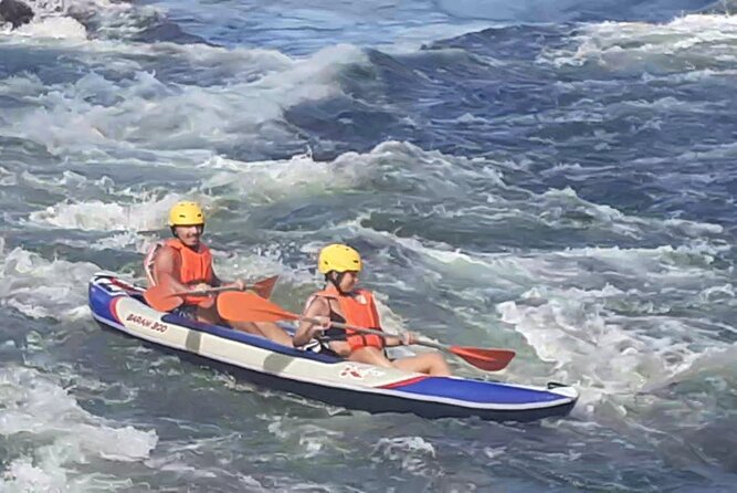 Rafting Experience on the Minho River with Coraltours Minho - Rapids, swimming, and the rock-jump stop