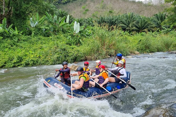 Rainforest Day Trip with Cave, Rafting, ATV & Lunch - Bamboo rafting on calmer jungle water
