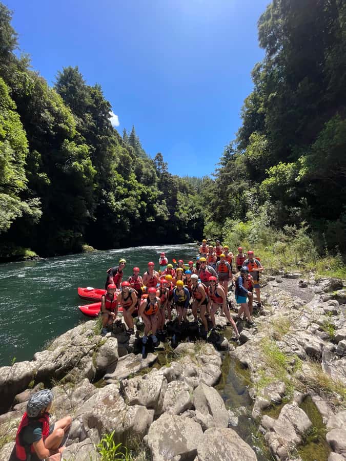 Rotorua: Tarawera River Raft and Kayak Adventure - Forest, waterfalls, and birds beside the boat