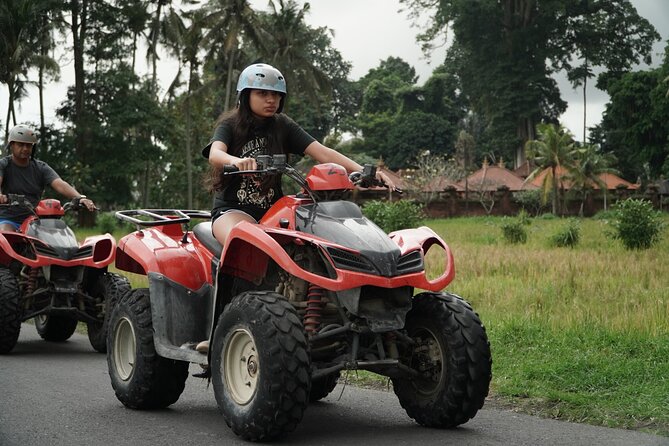 Ubud ATV and Rafting Experience - Riding ATVs through fields and villages