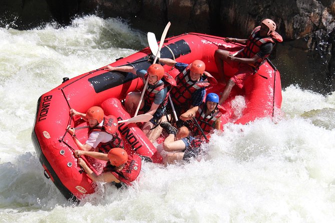 White Water Rafting & Swimming under the Falls - The morning begins with rocks, water, and a steep route